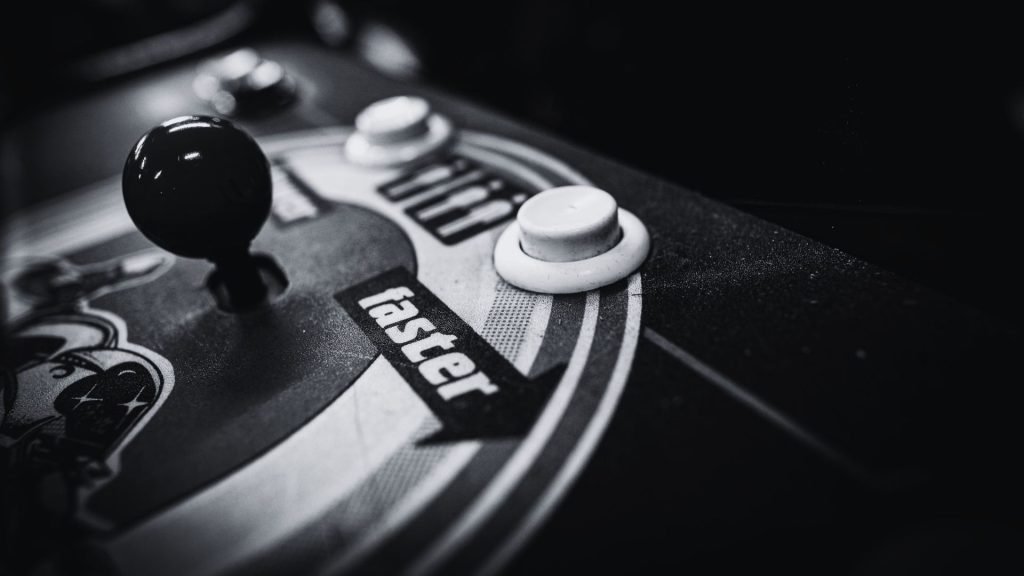Chaining Custom GPTs for content creation - Black and white image of a video game with faster near the buttons and joy stick