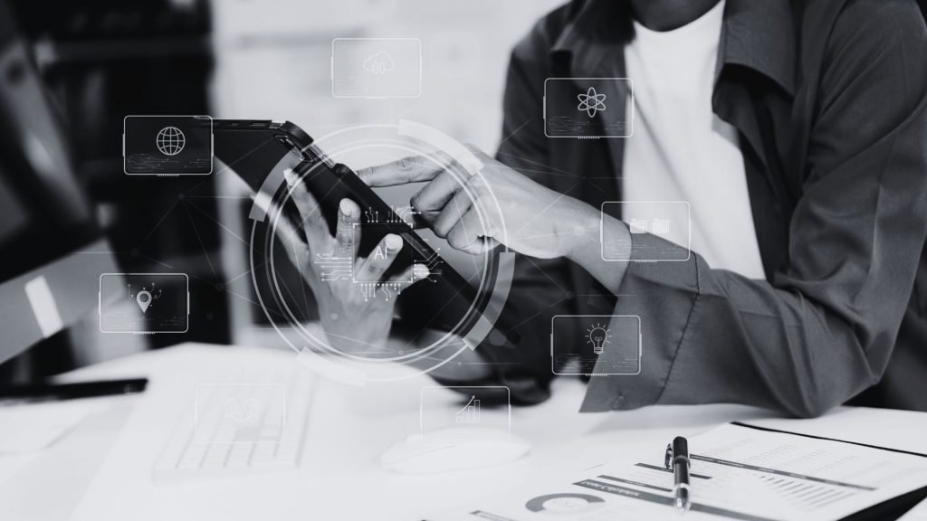 AI and the Future of Work What to Do Now - Black and white photo of a woman holding a tablet